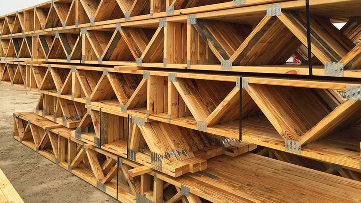 Open-web timber floor trusses installed on a commercial construction site in Tennessee.