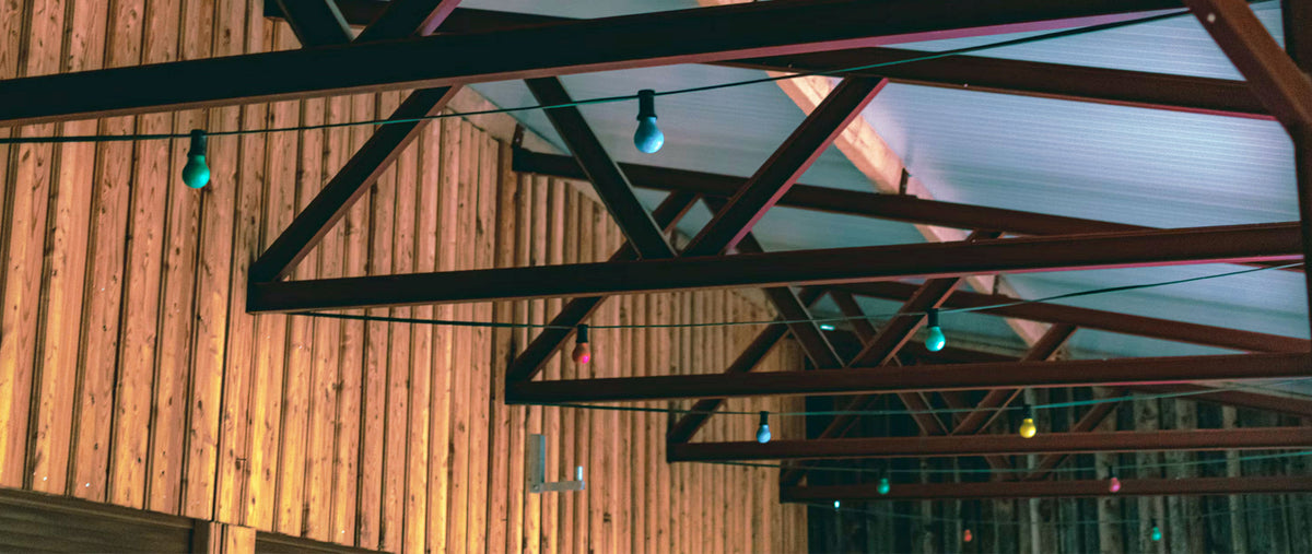 Clear-span Southern Yellow Pine engineered roof trusses framed on a commercial jobsite in Arizona.
