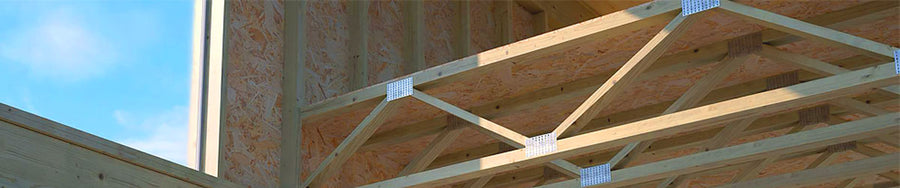 Open-web timber floor trusses installed on a commercial construction site in Beaumont, Texas.