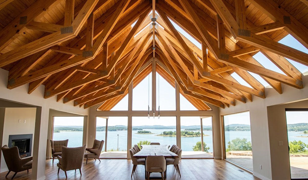 Vaulted scissor timber roof trusses installed in the high-ceiling great room of a custom home in Belton near Temple, TX.
