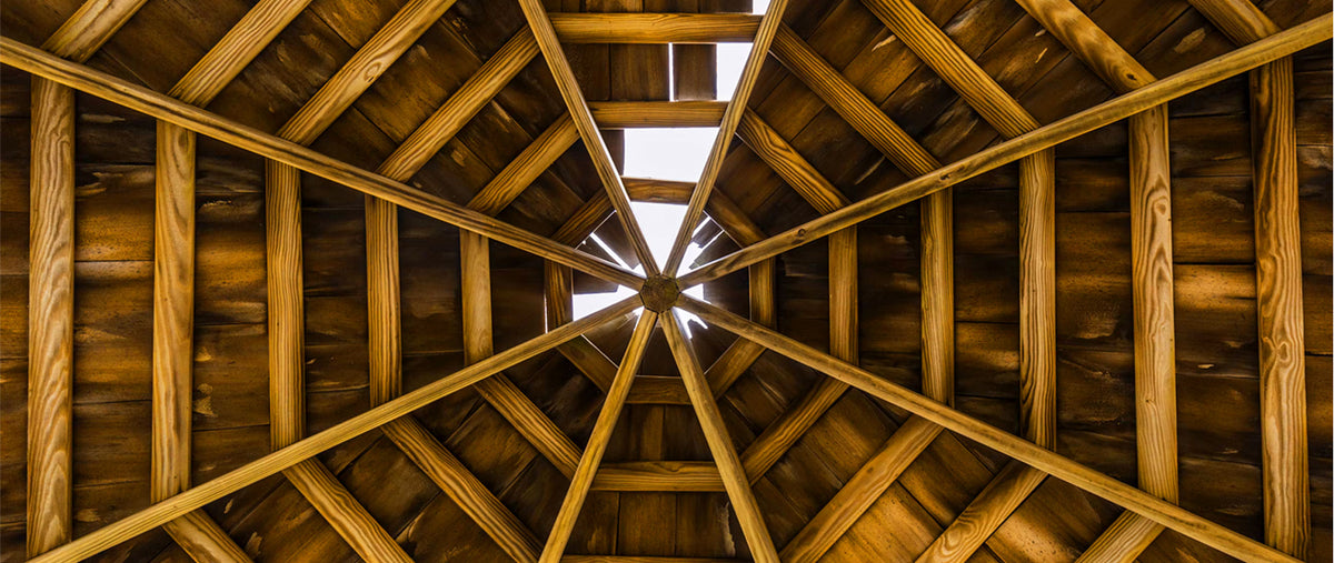 Clear-span Southern Yellow Pine engineered roof trusses framed on a commercial jobsite in Florida.