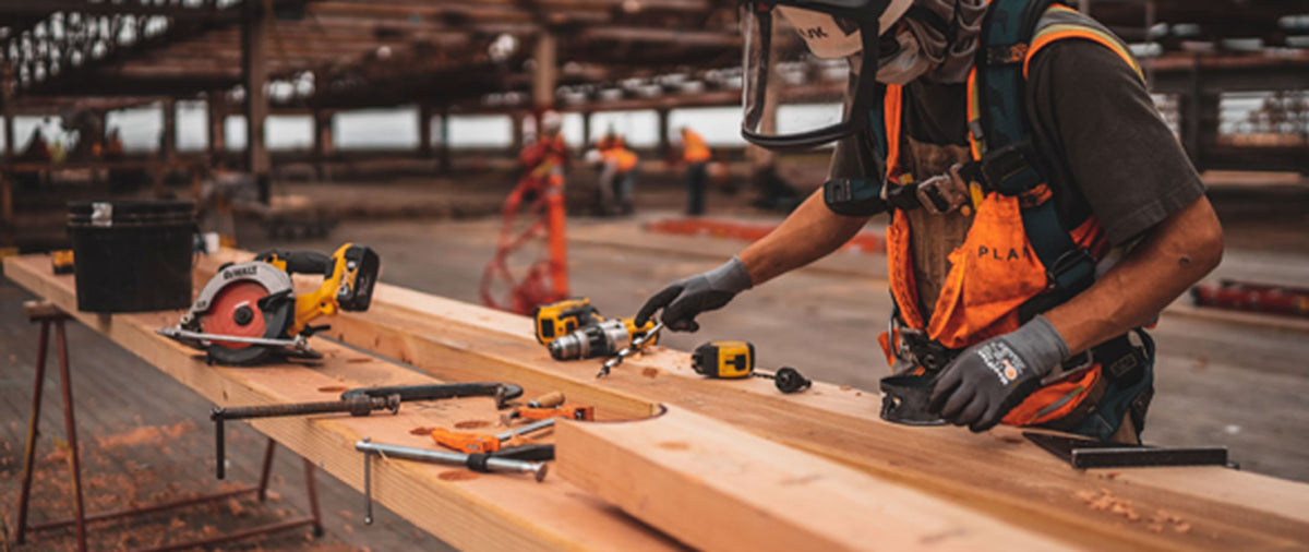Clear-span Southern Yellow Pine engineered roof trusses erected across an active commercial jobsite.