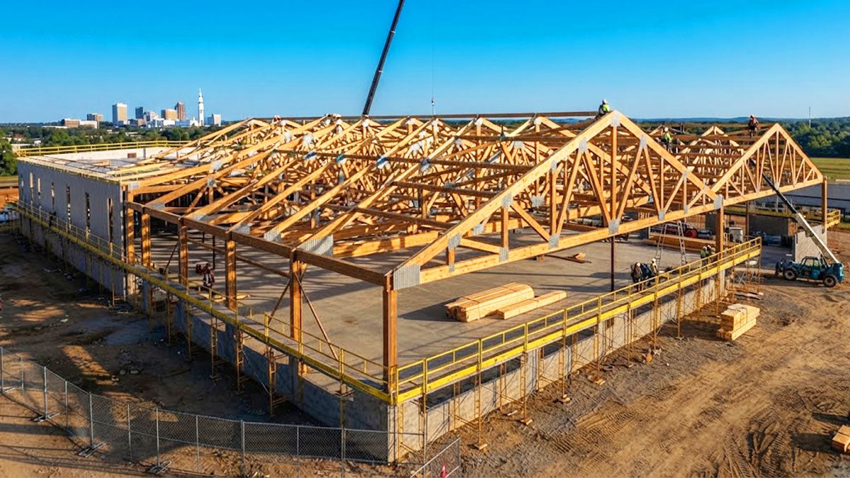 Commercial facility framed with clear-span timber roof trusses in Huntsville, Alabama.