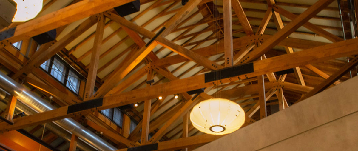 Clear-span Southern Yellow Pine engineered roof trusses framed on a commercial jobsite in Kansas.