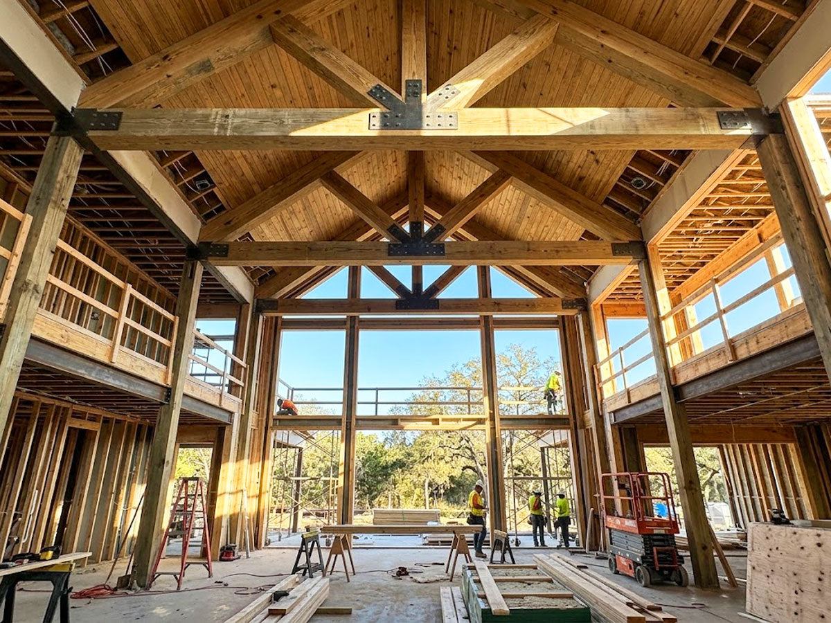 Vaulted timber scissor roof trusses installed in a custom residential estate in Katy, Texas.