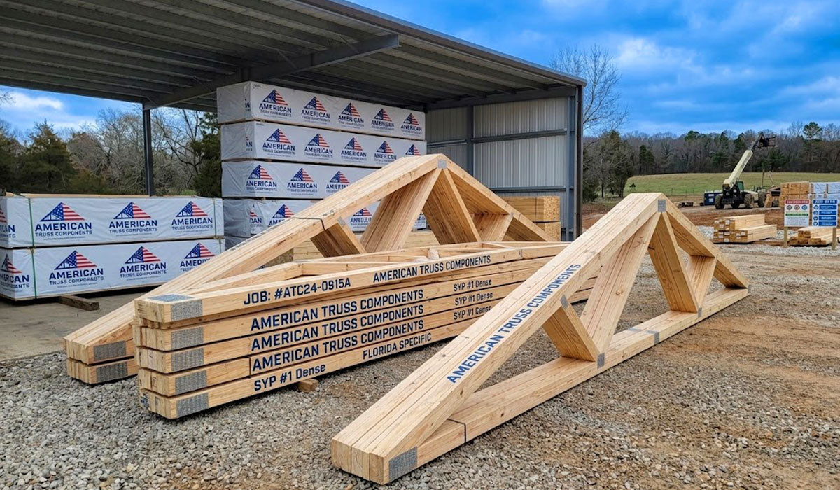 Engineered wood roof trusses bundled and banded for residential and commercial delivery in Tyler, TX.
