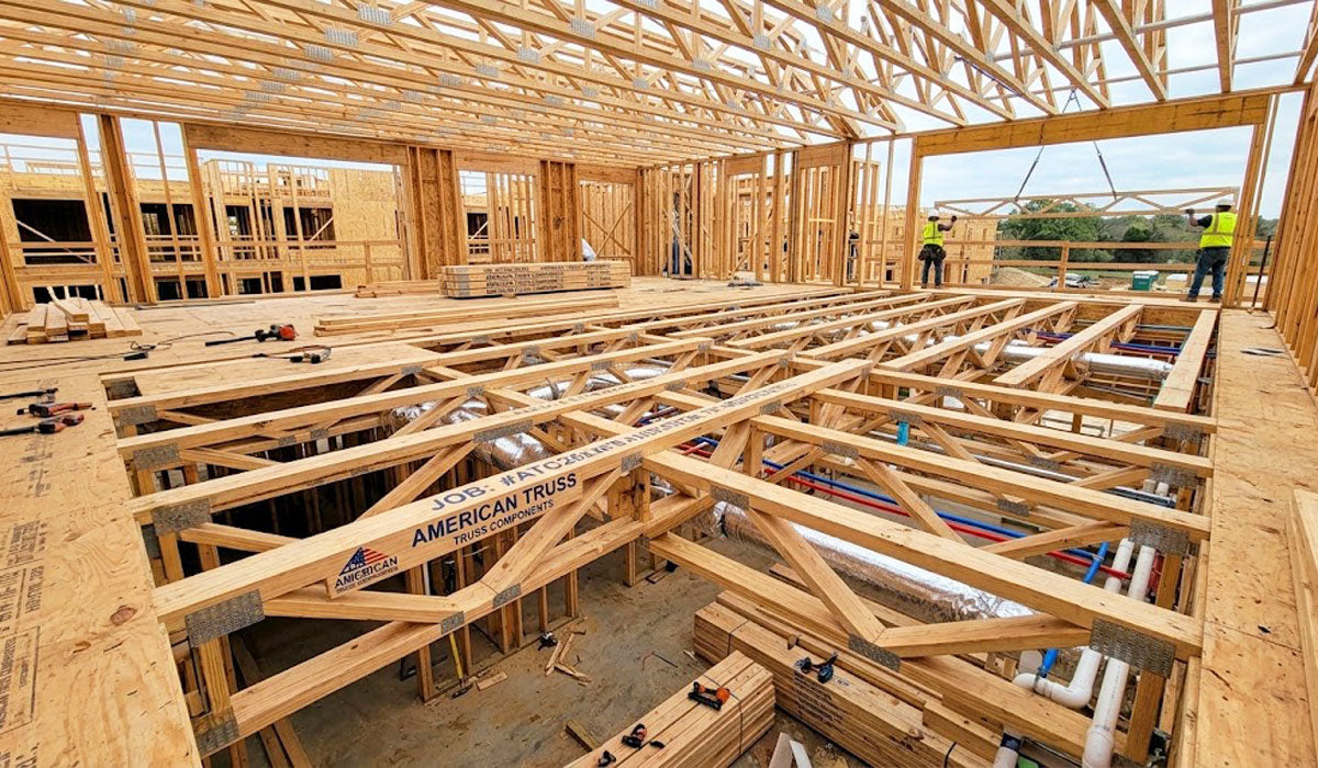 Open-web timber floor trusses installed on a commercial jobsite in Smith County, Tyler, Texas.
