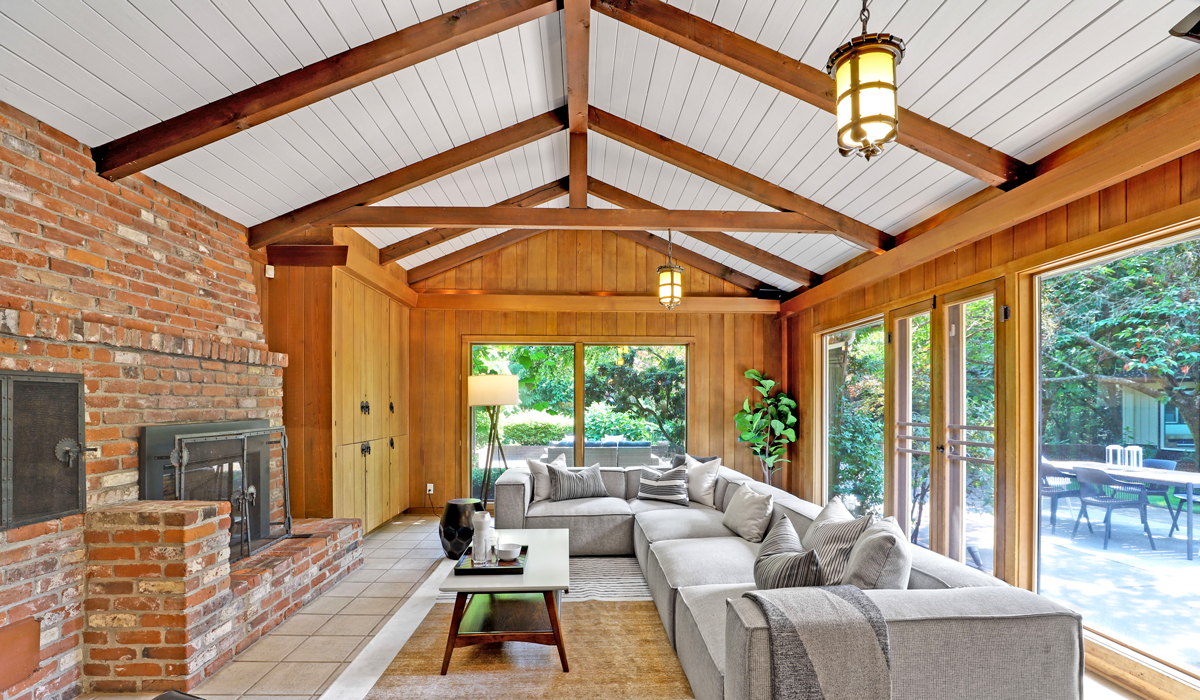 Vaulted scissor timber roof trusses installed in the high-ceiling great room of a custom home in Wolfforth near Lubbock, TX.